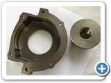 CNC Machined Bearing House (on left)